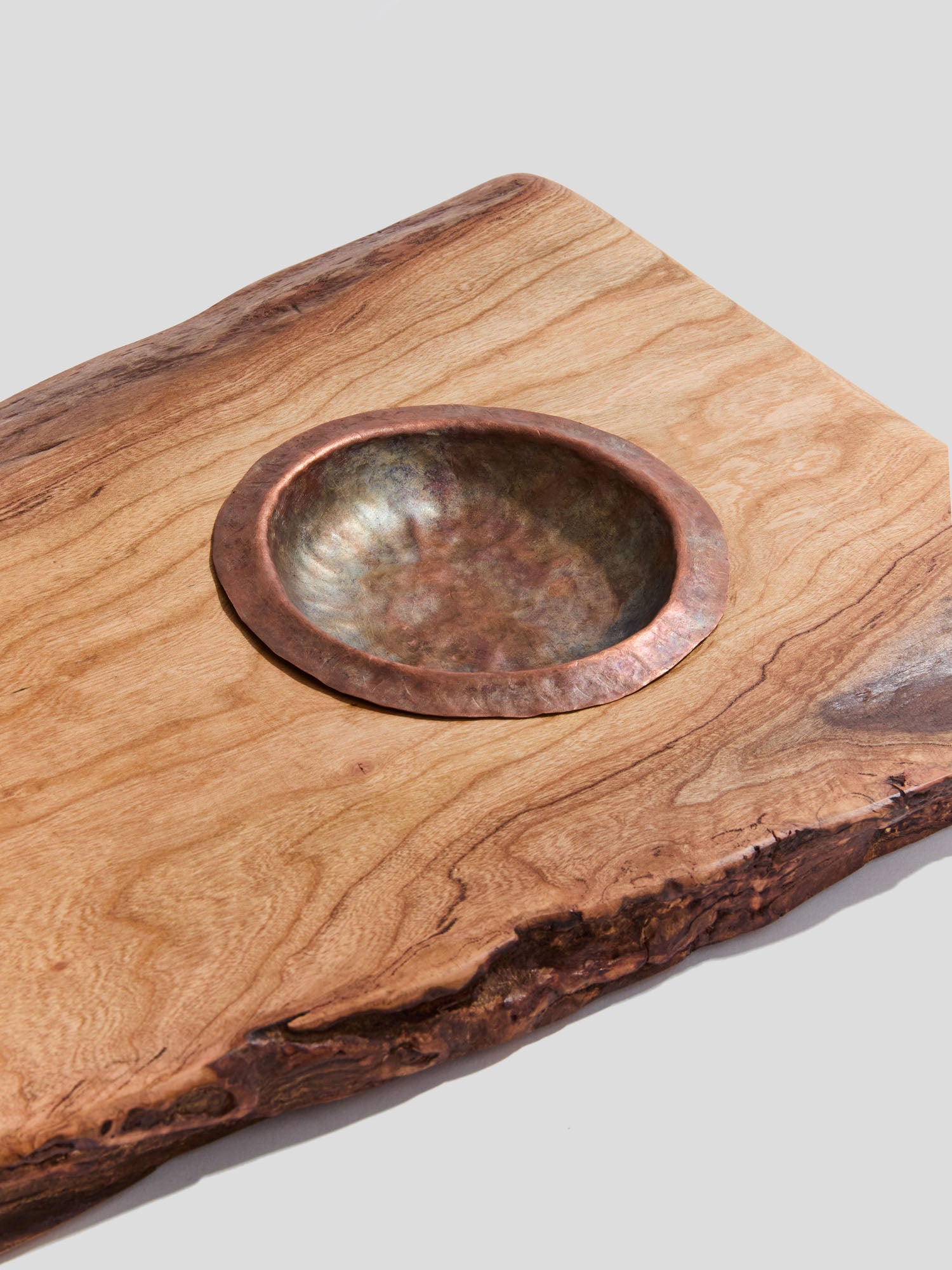  live-edge cherry wood bath tray with a hand-hammered copper ashtray