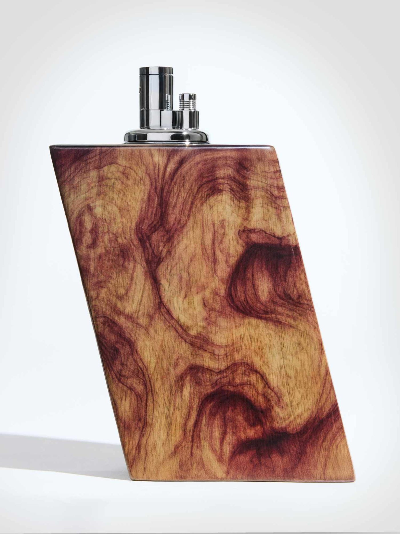 Wooden lighter with metallic top on a white background