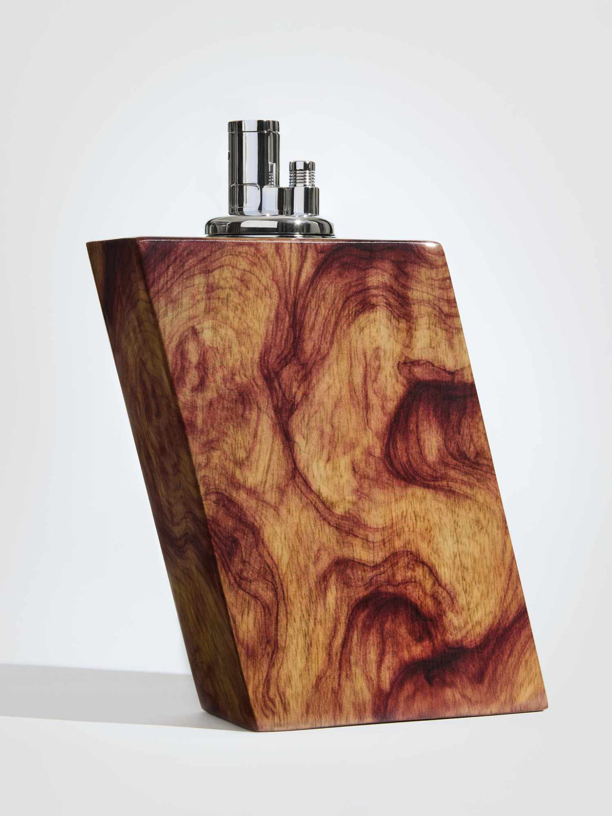 Wooden lighter with silver cap on a white background